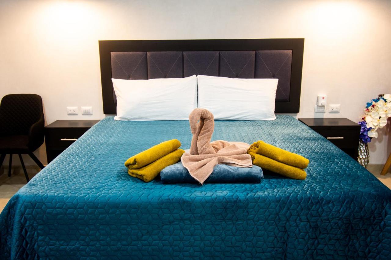 Hotel Casa Tortuga Tulum - Cenotes Park Inclusive Exterior photo A bed with a towel swan