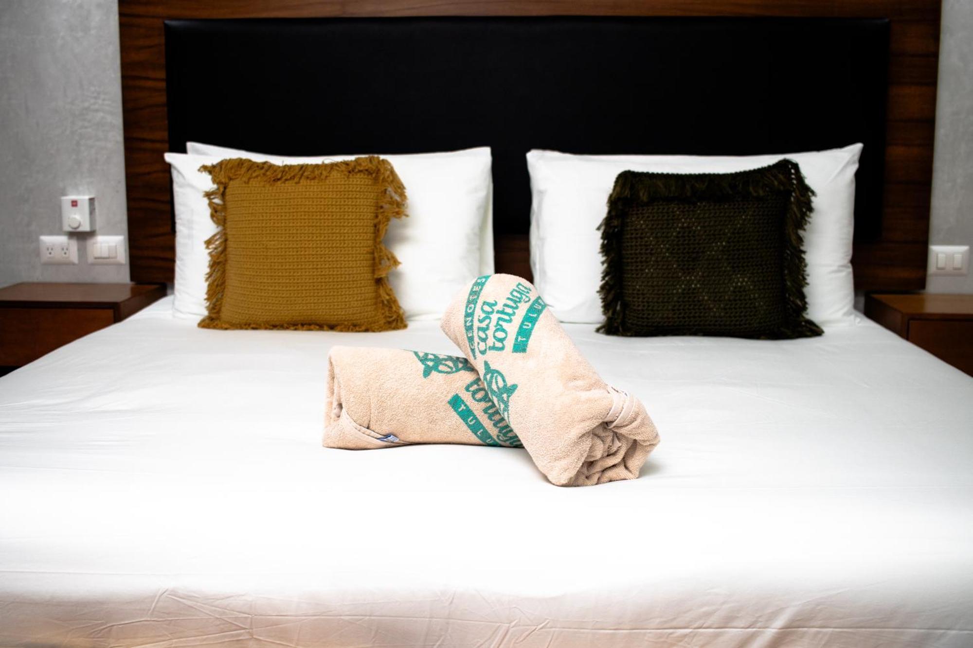 Hotel Casa Tortuga Tulum - Cenotes Park Inclusive Exterior photo A bed with a folded blanket