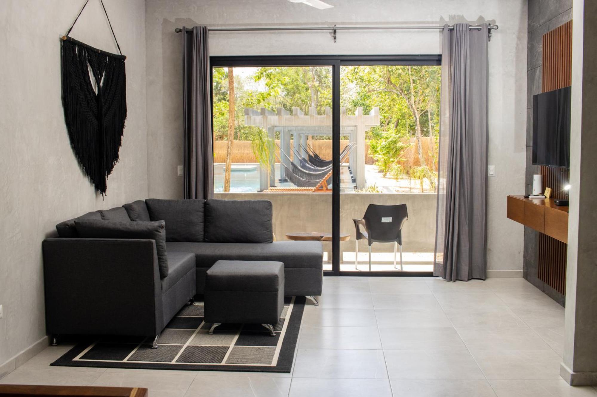 Hotel Casa Tortuga Tulum - Cenotes Park Inclusive Exterior photo A living room with a hammock
